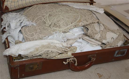 A large collection of hand worked crochet linens in a trunk